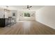 Open concept living room with view to kitchen and view to backyard at 191 Kyndal Dr, Hampton, GA 30228