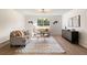 Inviting living room with comfortable seating, modern decor, and natural light, perfect for relaxation at 191 Kyndal Dr, Hampton, GA 30228