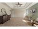 Large main bedroom with tray ceilings, natural light, and elegant furnishings at 191 Kyndal Dr, Hampton, GA 30228