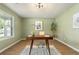 Bright office space with neutral walls, hardwood floors and natural light, perfect for remote work at 191 Kyndal Dr, Hampton, GA 30228