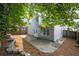 Spacious backyard with patio area, lush landscaping, and privacy fence at 2890 Winterhaven Ct, Atlanta, GA 30360