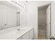 Clean bathroom featuring a large mirror, ample counter space and a tub at 2890 Winterhaven Ct, Atlanta, GA 30360