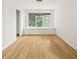 Well-lit bedroom with hardwood floors, a window seat, and views of mature trees at 2890 Winterhaven Ct, Atlanta, GA 30360