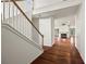 View of foyer with hardwood floors, staircase and view into the living room at 2890 Winterhaven Ct, Atlanta, GA 30360