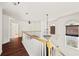 Bright hallway showcasing hardwood floors, white railings, and natural light from arched windows at 2890 Winterhaven Ct, Atlanta, GA 30360