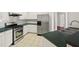 Kitchen featuring stainless steel appliances, white cabinets, and a dark countertop at 2890 Winterhaven Ct, Atlanta, GA 30360