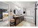 Bathroom featuring a vanity with dual sinks and a separate tub at 468 Lake Ridge Ln, Fairburn, GA 30213