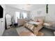 A cozy bedroom with a bed, dresser, and hanging chair at 468 Lake Ridge Ln, Fairburn, GA 30213