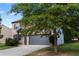 Exterior view of home with garage at 468 Lake Ridge Ln, Fairburn, GA 30213