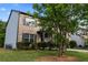 Exterior view of home with a tree in the yard at 468 Lake Ridge Ln, Fairburn, GA 30213