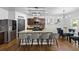 Bright kitchen featuring a large island, barstool seating, and stainless steel appliances at 468 Lake Ridge Ln, Fairburn, GA 30213