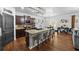 Open kitchen with granite countertops, center island with barstool seating, and stainless steel appliances at 468 Lake Ridge Ln, Fairburn, GA 30213