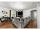 Inviting living room with a modern fireplace and neutral paint, plus a large sectional and wood floors at 468 Lake Ridge Ln, Fairburn, GA 30213