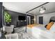 A stylish main bedroom suite with dark walls, chandelier, and modern furniture at 468 Lake Ridge Ln, Fairburn, GA 30213