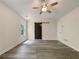 Bright bedroom featuring vaulted ceiling, fan, and a sliding barn door entering the closet at 6001 Deer Springs Nw Ln, Acworth, GA 30101