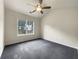 Well-lit bedroom with a ceiling fan, a neutral color palette, and plush carpet at 6001 Deer Springs Nw Ln, Acworth, GA 30101