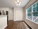 Dining area featuring a window with natural light, hardwood floors and closet storage space at 6001 Deer Springs Nw Ln, Acworth, GA 30101
