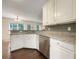 Well-lit kitchen featuring granite countertops, stainless steel appliances, and dark hardwood floors at 6001 Deer Springs Nw Ln, Acworth, GA 30101
