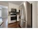 Kitchen featuring stainless steel appliances, including a refrigerator, gas range, and microwave at 6001 Deer Springs Nw Ln, Acworth, GA 30101