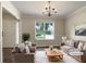 Bright living room featuring hardwood floors, large windows, and neutral decor, creating a welcoming and comfortable space at 6001 Deer Springs Nw Ln, Acworth, GA 30101