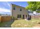 Spacious backyard with a well maintained lawn and wooden fence at 104 Auburn Crossing Way, Auburn, GA 30011