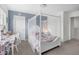 Charming bedroom with a four-poster bed, a desk, and soft colors, creating a delightful and inviting space at 104 Auburn Crossing Way, Auburn, GA 30011