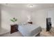 Comfortable bedroom with a bed, nightstands, and a TV, creating a relaxing and inviting space at 104 Auburn Crossing Way, Auburn, GA 30011
