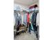 Organized walk-in closet with ample storage for clothing, shoes, and accessories at 104 Auburn Crossing Way, Auburn, GA 30011