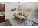 Cozy dining area featuring a wooden table, comfortable seating, and natural light at 104 Auburn Crossing Way, Auburn, GA 30011