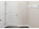 Clean entryway featuring a white door and wall-mounted hooks at 104 Auburn Crossing Way, Auburn, GA 30011