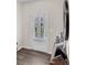 Stylish entryway featuring wood-look floors, neutral walls, and decorative accents at 104 Auburn Crossing Way, Auburn, GA 30011