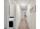 Hallway with laundry area and access to other rooms at 104 Auburn Crossing Way, Auburn, GA 30011