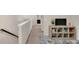 Upstairs hallway featuring a shelving unit with decor at 104 Auburn Crossing Way, Auburn, GA 30011