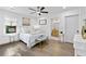 Bright bedroom featuring hardwood floors, modern decor, and adjoining bathroom at 1643 Flintwood Se Dr, Atlanta, GA 30316