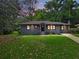 Charming single-story home featuring a well-manicured lawn and freshly painted exterior at 1643 Flintwood Se Dr, Atlanta, GA 30316