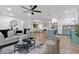 Open floor plan living room with hardwood floors connects to dining area and kitchen at 1643 Flintwood Se Dr, Atlanta, GA 30316