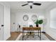 Home office showcasing modern desk, neutral rug, and natural light at 1643 Flintwood Se Dr, Atlanta, GA 30316