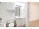 Clean bathroom features white fixtures, tile accents, and a mirror with vanity lighting at 200 Ridge Bluff Ln, Suwanee, GA 30024