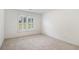 Inviting bedroom with soft carpeting and a bright window with shutter blinds at 200 Ridge Bluff Ln, Suwanee, GA 30024