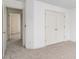 Spacious bedroom featuring plush carpeting and a double-door closet at 200 Ridge Bluff Ln, Suwanee, GA 30024
