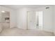 Large bedroom has carpet, neutral paint and gives access to the kitchen and bathroom at 200 Ridge Bluff Ln, Suwanee, GA 30024