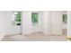 Well-lit bedroom with carpeted floors and multiple windows offers ample natural light at 200 Ridge Bluff Ln, Suwanee, GA 30024