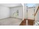 Bright foyer featuring wood floors and a staircase with white railings at 200 Ridge Bluff Ln, Suwanee, GA 30024