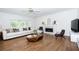 Comfortable living room with modern furnishings and a fireplace focal point at 200 Ridge Bluff Ln, Suwanee, GA 30024