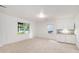 Bright living space featuring carpeting, natural light, and a convenient kitchenette at 200 Ridge Bluff Ln, Suwanee, GA 30024