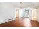Bright and airy main bedroom with hardwood floors, a trey ceiling, and arched window at 200 Ridge Bluff Ln, Suwanee, GA 30024