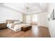 Luxurious main bedroom with tray ceilings, hardwood floors, and ample closet space at 200 Ridge Bluff Ln, Suwanee, GA 30024