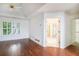 Spacious main bedroom featuring hardwood floors and a view of the ensuite bathroom at 200 Ridge Bluff Ln, Suwanee, GA 30024