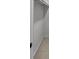 The closet has neutral walls, carpet, shelves, and bar for hanging clothes at 2798 Hutchins Rd, Lawrenceville, GA 30044