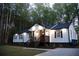 Charming renovated home with a red door, covered porch, and stylish modern farmhouse features at 2798 Hutchins Rd, Lawrenceville, GA 30044
